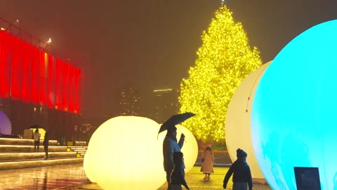 Christmas tree glows with moonGarden Installation at South Street Seaport in NYC Video stock 297419782