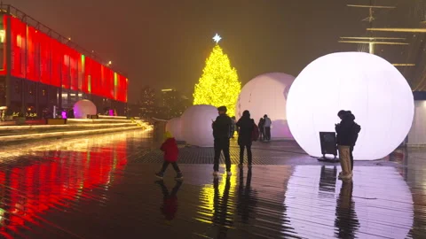 Christmas tree glows with moonGarden Installation at South Street Seaport in NYC Stock Footage 297828496