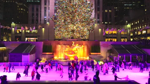 Christmas Tree glows in Rockefeller Center in New York City. Stock Footage 226676544