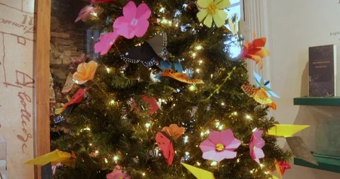 Christmas Tree with Hand-made Paper Ornaments of Flowers, Birds and Butterflies Stock Footage 121541545
