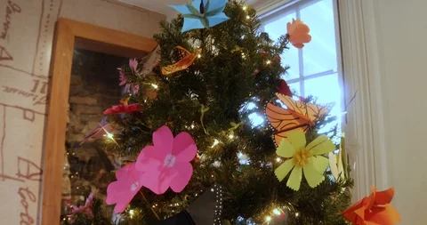 Christmas Tree with Hand-made Paper Ornaments of Flowers, Birds and Butterflies Stock Footage 121541559
