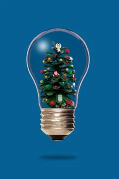 Christmas tree inside a light bulb Foto stock