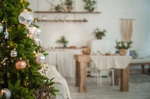 Christmas tree in the interior in defocus. Background for a Christmas card in li Stock Photos