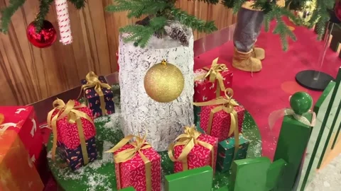 Christmas tree. Large boxes with bows. Gifts of different sizes. Stock Footage 255603547