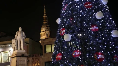 Christmas tree with light and balls in background dome e statue o Stock Footage 83788203