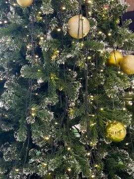 Christmas tree with light bulbs background Stock Photos