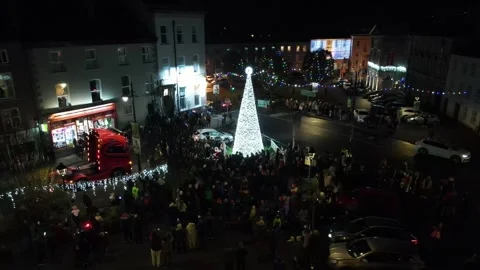 Christmas Tree light switch on illumination. Clones, Monaghan, Ireland Stock Footage 294340141