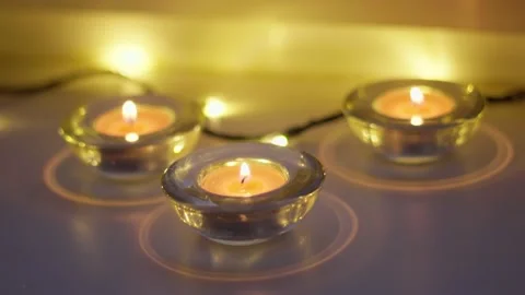 Christmas tree lights and lit candles with nice blurred background Stock Footage 225283562