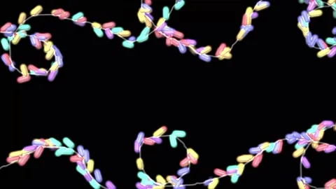 Christmas tree lights with colored lanterns on a black background. Stock Footage 224546202