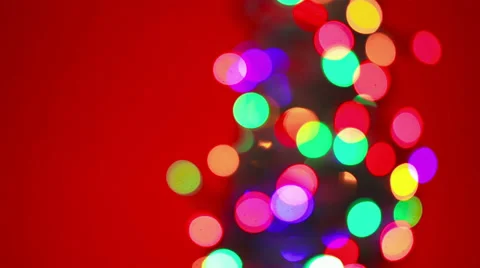 Christmas tree lights on red background Video stock 30701108