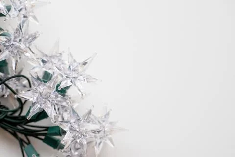 Christmas tree lights in the shape of a star on a white background Stock Photos