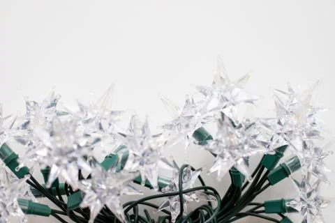 Christmas tree lights in the shape of a star on a white background Stock Photos