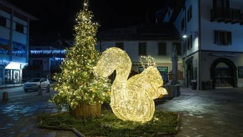 Christmas tree with luminous squirrel in Piazza Collini in Pinzolo Italy Stock Photos