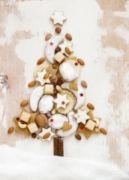 Christmas tree made from different kinds of homemade cookies on a white Stock Photos