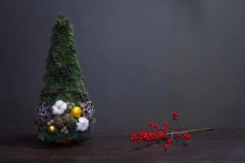 Christmas tree made of fir branches and decorated by natural materials and br Stock Photos