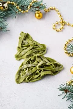 Christmas tree made of fresh homemade spinach pasta. Stock Photos