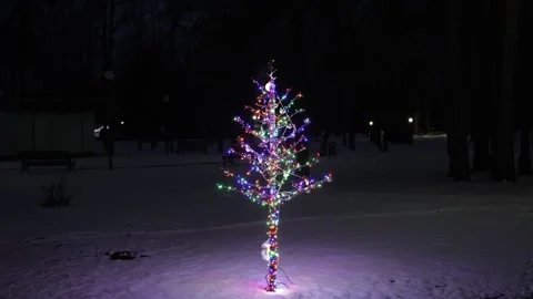 A Christmas tree made of iron with lanterns. A Christmas tree-shaped garland arr Stock Footage 325746446