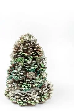 Christmas tree made of pinecones over white background with copy Foto stock