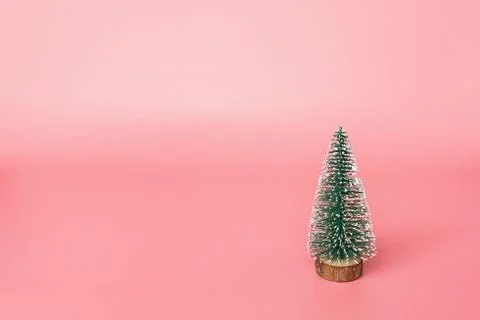 Christmas tree made in pink background with copy space for text. Minimal xmas Stock Photos