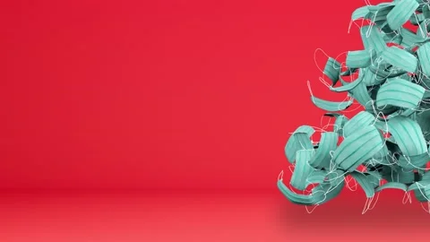Christmas tree made of protective masks with red background Copy space Stock Footage 144731191
