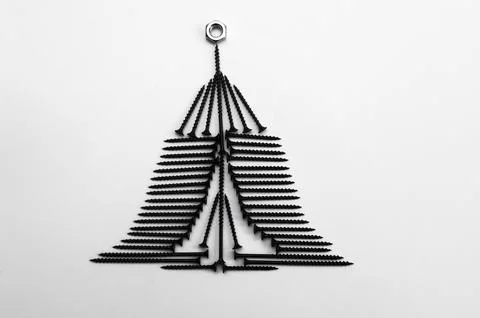 A Christmas tree made of self-tapping screws. concept Stock Photos