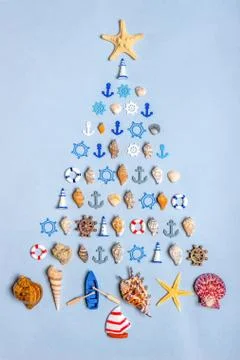 Christmas tree made of various seashells, sea stars, decorative items and min Stock Photos