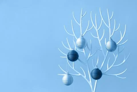 Christmas tree made of white plastic horns and bauble decoration 스톡 사진