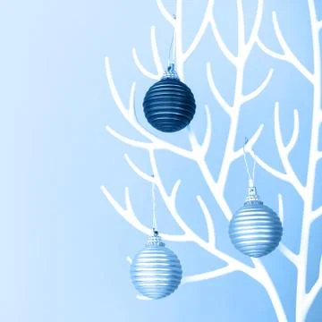 Christmas tree made of white plastic horns and bauble decoration on the blue Stock Photos
