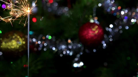 Christmas tree, mirror ball and lit sparkler, FULL HD Stock Footage 32503075