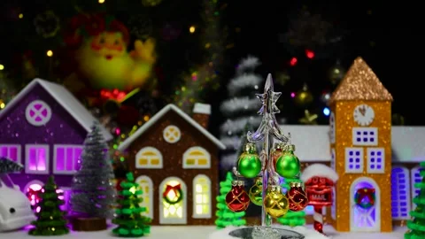 Christmas tree moves against of a large Christmas town with a chapel Stock Footage 293154489