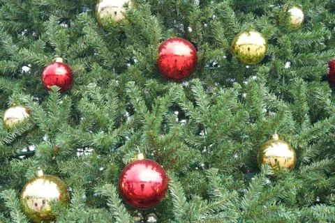 Christmas tree with multi-colored balls and decorations background Stock Photos