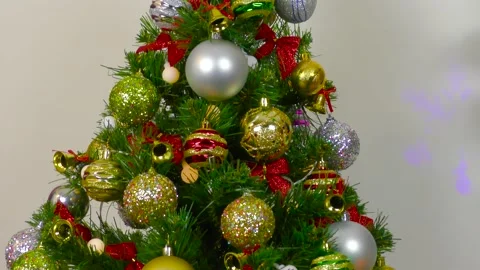 Christmas tree near a small composition with burning candles and a gift Stock Footage 201014554