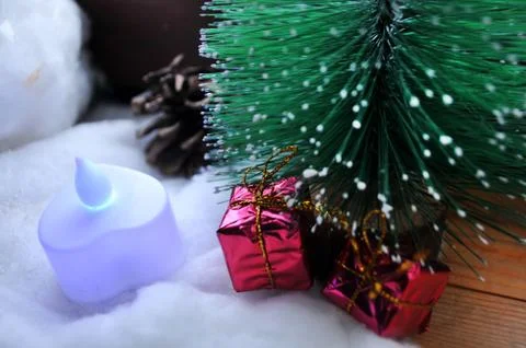 Christmas tree next to a cold window Stock Photos