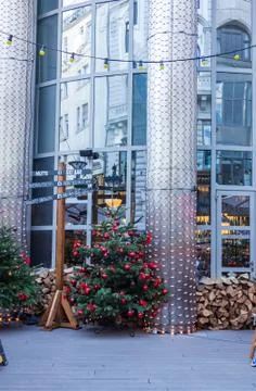 Christmas tree next to a pillar with a direction indicator, Budapest, Hungary Stock Photos