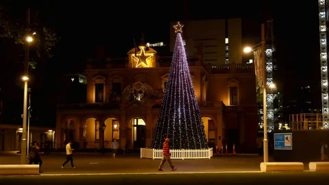 Christmas tree night time festive holidays urban scene 4k Stock Footage 99417102