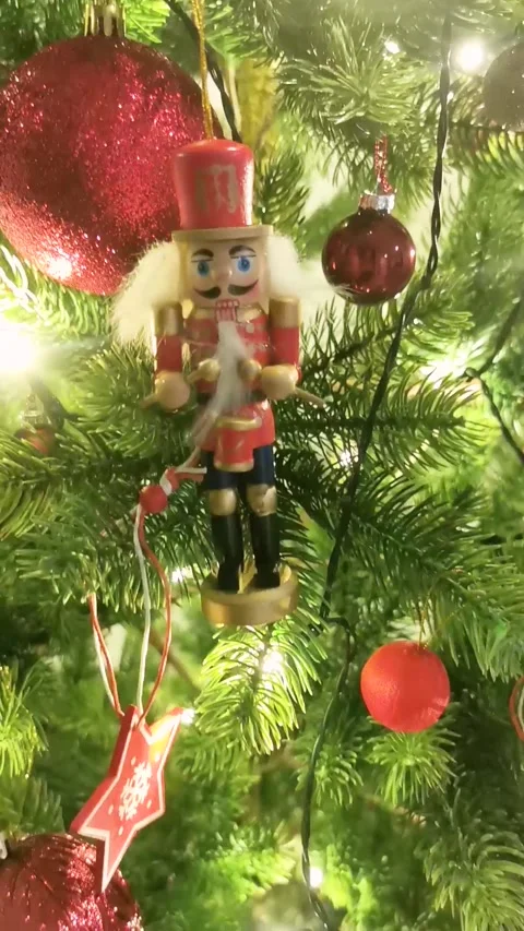 A Christmas tree with a nutcracker ornament hanging from it Stock Footage 279005371