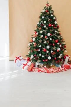 Christmas tree pine decor beige background New Year holiday gifts Stock Photos