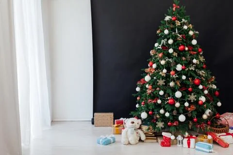 Christmas tree pine decor black background New Year holiday gifts Stock Photos