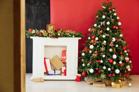 Christmas tree pine decor red background New Year holiday gifts Stock Photos
