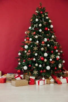 Christmas tree pine decor red background New Year holiday gifts Фото