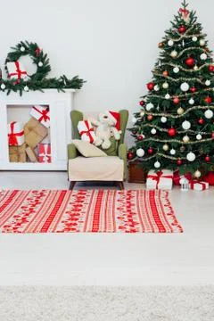 Christmas tree pine with fireplace interior of the house new year decoration Stock Photos