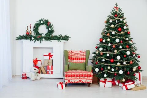 Christmas tree pine with fireplace interior of the house new year decoration 스톡 사진
