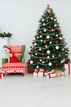 Christmas tree pine with fireplace interior of the house new year decoration Фото