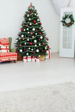 Christmas tree pine with fireplace interior of the house new year decoration Stock Photos