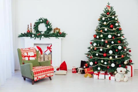 Christmas tree pine with fireplace interior of the house new year decoration Stock Photos