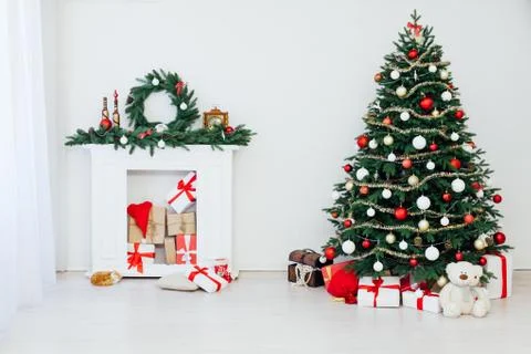 Christmas tree pine with fireplace interior of the house new year decoration 스톡 사진