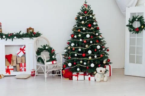 Christmas tree pine with fireplace interior of the house new year decoration 스톡 사진