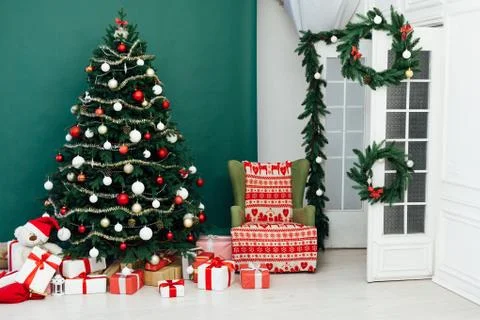 Christmas tree pine green interior room new year decor garland gifts postcard Stock Photos