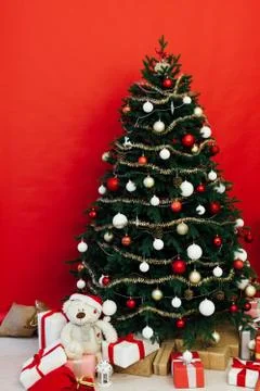 Christmas tree pine red interior house new year decor garland gifts postcard Stock Photos