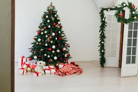 Christmas tree pine white interior room new year decor garland gifts postcard Фото